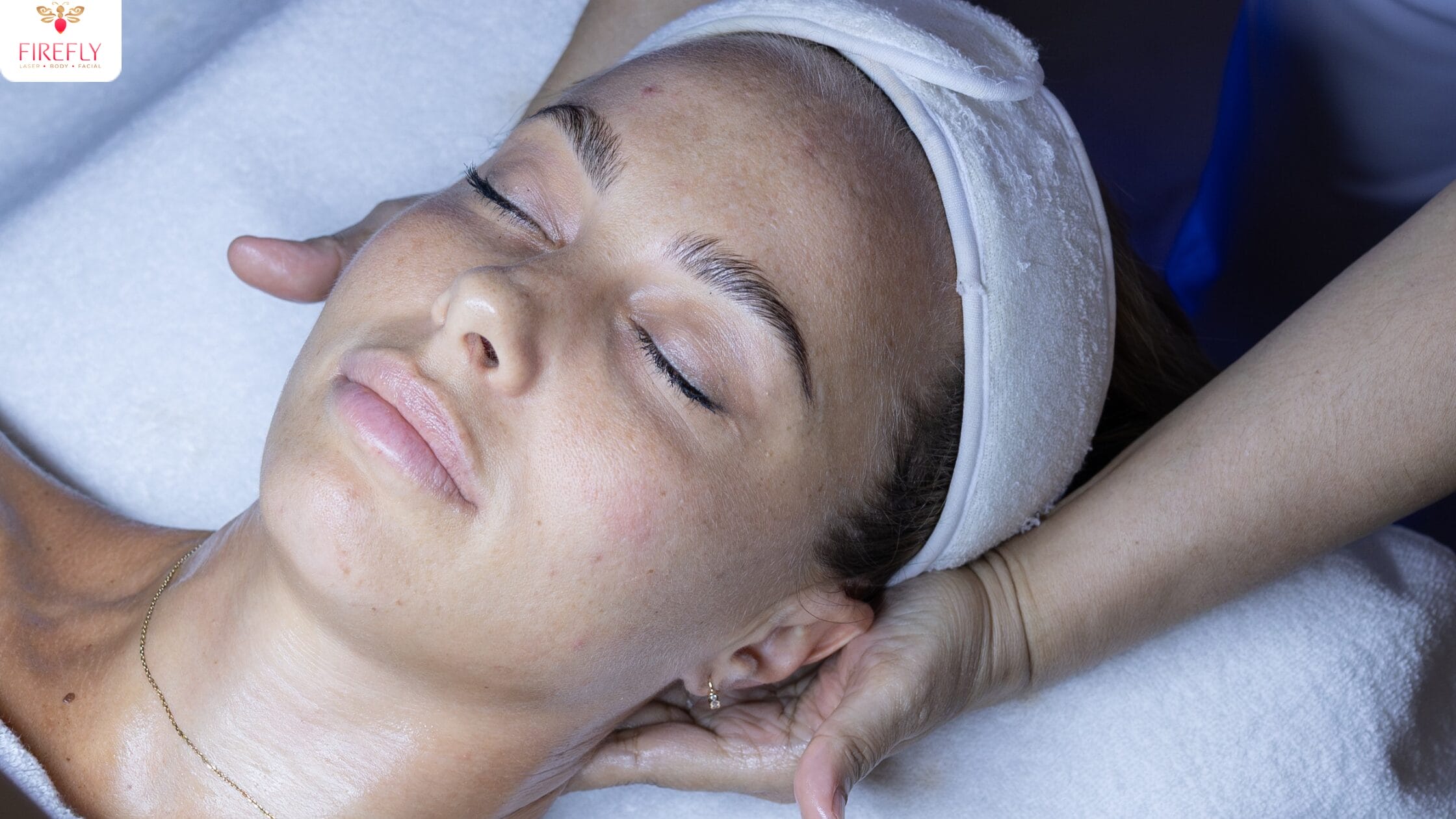 Neck stretch included in Firefly’s Hydrafacial for tension relief.