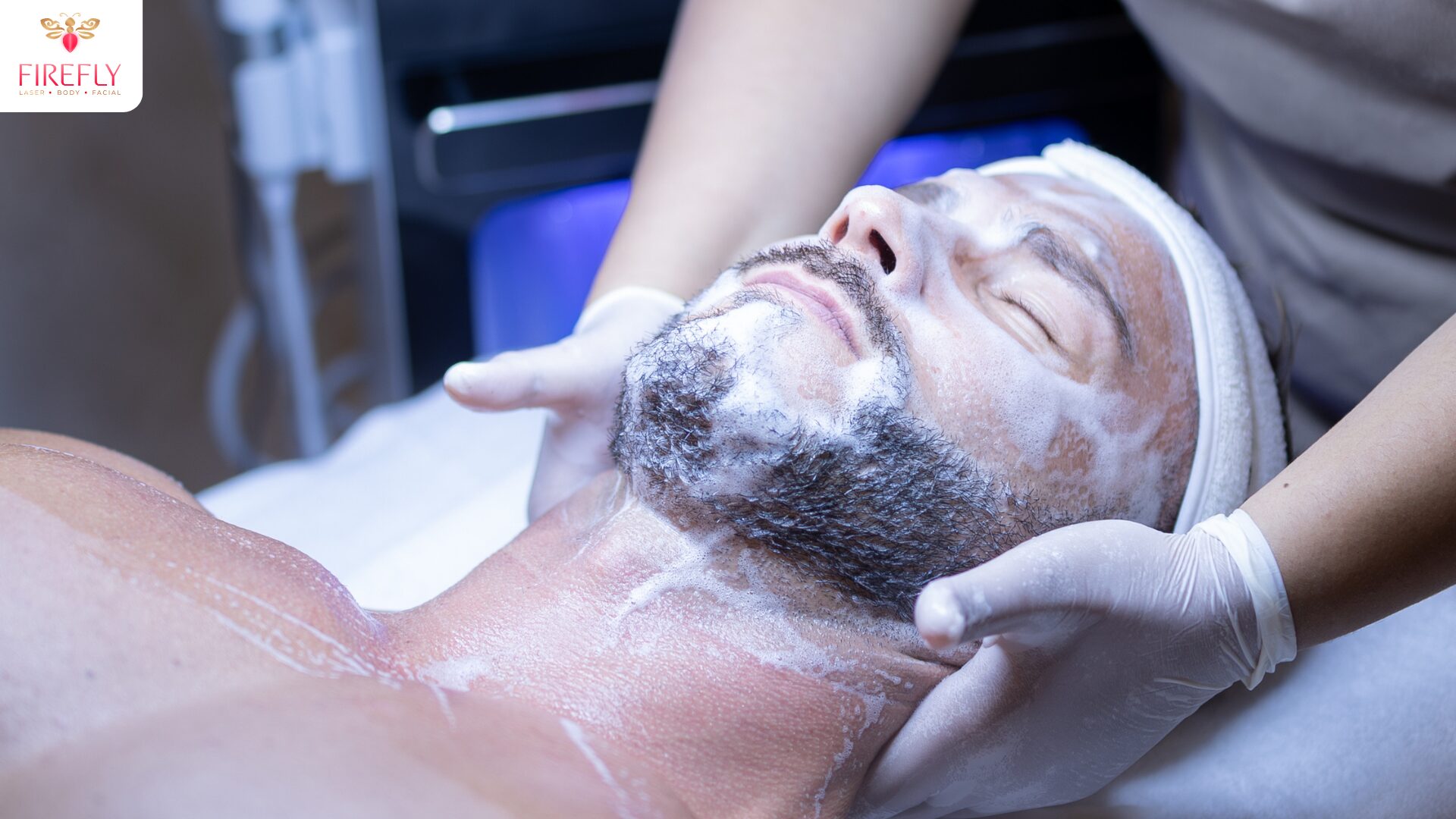 Man receiving facial treatment with cleanser foam in Bali clinic