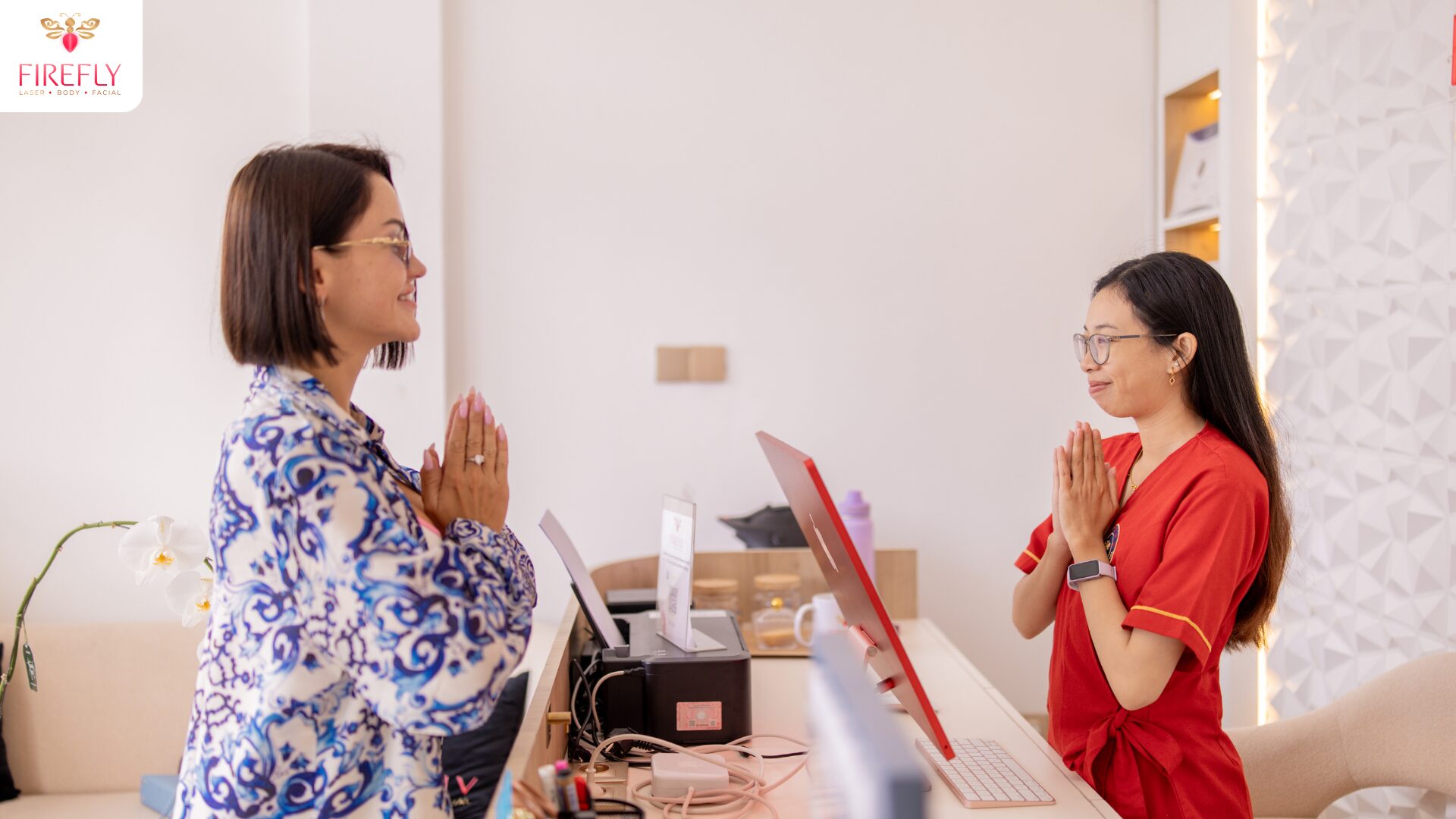Client checking in at Firefly Laser Canggu Bali reception before facial treatment