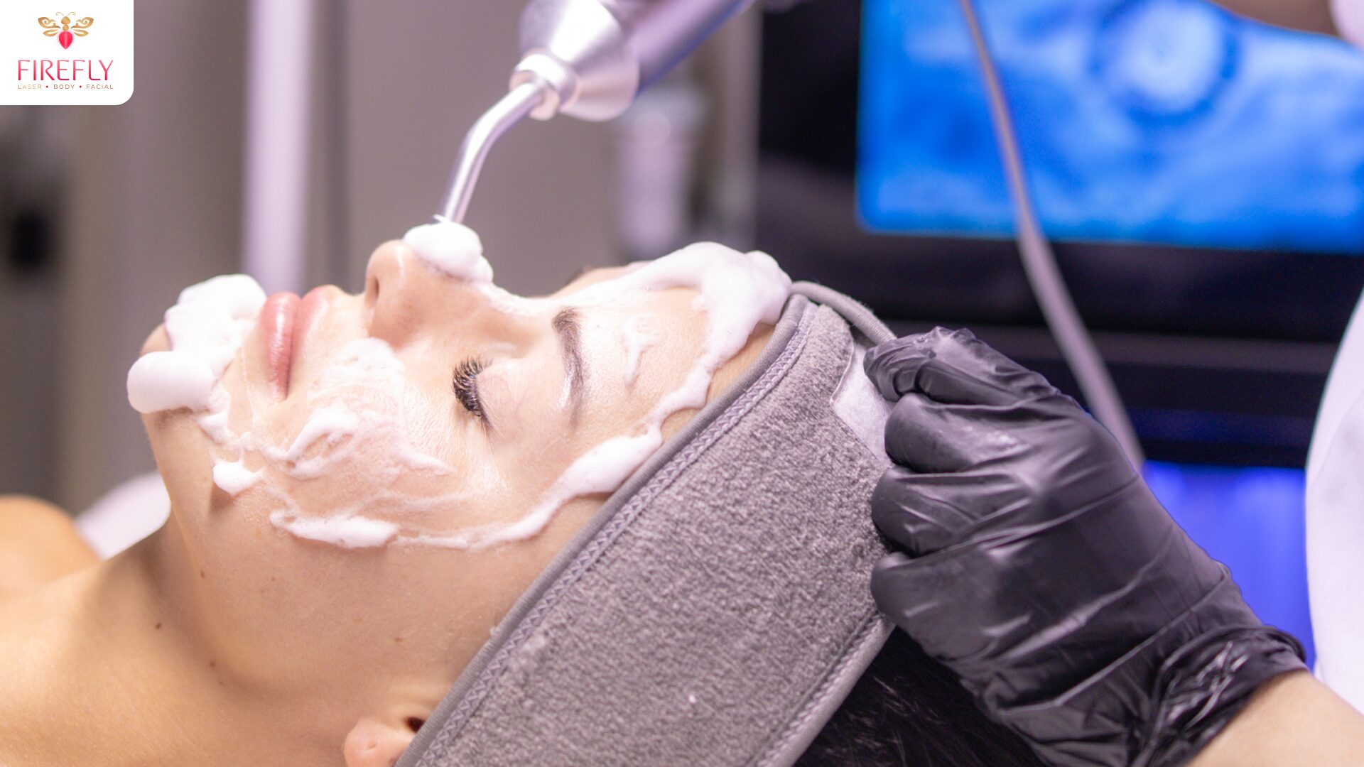 HydraFacial style cleansing treatment with foam on woman’s face